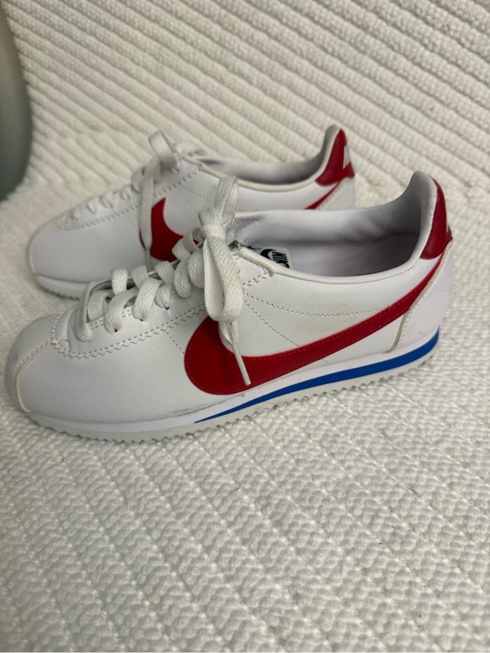 Nike Kids White Sneakers with Red Swoosh and Blue Trim